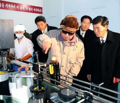 North Korean leader Kim Jong-il (C) visits the newly-built Soy Sauce Shop at the Ryongsong Foodstuff Factory in North Korea in this undated picture released by North Korea's official KCNA news agency on November 24, 2010 North Korean leader Kim Jong-il (C) visits the newly-built Soy Sauce Shop at the Ryongsong Foodstuff Factory in North Korea in this undated picture released by North Korea's official KCNA news agency on November 24, 2010
