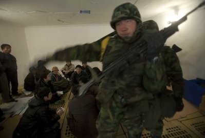 Residents of South Korea's Yeonpyeong Island, left, and South Korean soldiers take cover inside a bunker after authorities sounded an alarm to take shelter against a possible North Korean rocket attack Sunday, Nov. 28, 2010. Residents of South Korea's Yeonpyeong Island, left, and South Korean soldiers take cover inside a bunker after authorities sounded an alarm to take shelter against a possible North Korean rocket attack Sunday, Nov. 28, 2010.