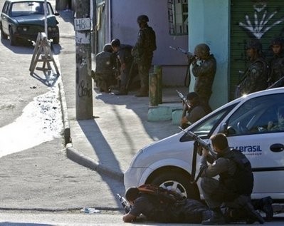 Brazilian soldiers guard the entrance to the Morro do Alemao shantytown in Rio de Janeiro, Brazil. Brazilian soldiers guard the entrance to the Morro do Alemao shantytown in Rio de Janeiro, Brazil.