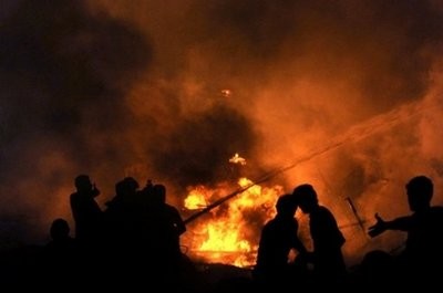 Pakistani firefighters extinguish a fire caused by a Russian-made cargo plane that crashed after taking off from Karachi airport. Pakistani firefighters extinguish a fire caused by a Russian-made cargo plane that crashed after taking off from Karachi airport.
