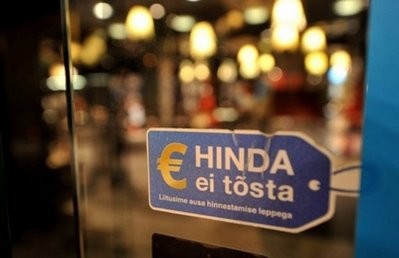 AFP - A label reads 'The Euro will not increase prices' on a shop door in Tallinn AFP - A label reads 'The Euro will not increase prices' on a shop door in Tallinn