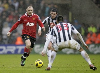 West Bromwich Albion's Graham Dorrans (2nd L) vies with Manchester United's Wayne Rooney (L) during the match. AFP West Bromwich Albion's Graham Dorrans (2nd L) vies with Manchester United's Wayne Rooney (L) during the match. AFP