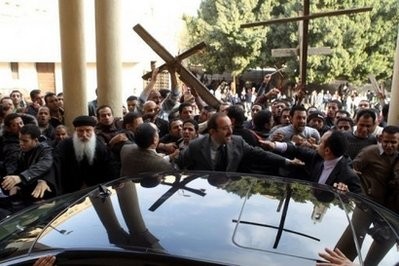 AFP - Angry Christian demonstrators pelted an Egyptian minister with stones on Sunday AFP - Angry Christian demonstrators pelted an Egyptian minister with stones on Sunday