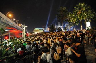 AFP - People make their way out of the waterfront after observing the fireworks display to welcome the New Year in Singapore on January 1, 2011. AFP - People make their way out of the waterfront after observing the fireworks display to welcome the New Year in Singapore on January 1, 2011.