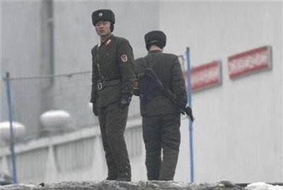 Armed North Korean soldiers stand guard on the banks of Yalu River near the North Korean town of Sinuiju, opposite the Chinese border city of Dandong, December 21, 2010 Armed North Korean soldiers stand guard on the banks of Yalu River near the North Korean town of Sinuiju, opposite the Chinese border city of Dandong, December 21, 2010