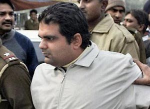 (File) Shivraj Puri is taken away by the police in Gurgaon, Haryana on Thursday (File) Shivraj Puri is taken away by the police in Gurgaon, Haryana on Thursday