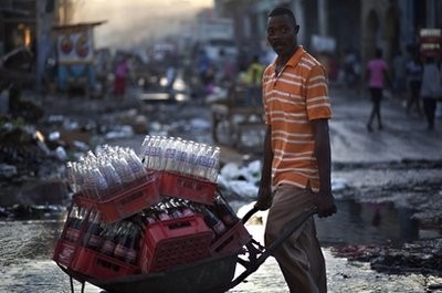 A man pushes a cart containing bottles of soda in Port-au-Prince, Haiti, Monday, Jan. 3, 2011 A man pushes a cart containing bottles of soda in Port-au-Prince, Haiti, Monday, Jan. 3, 2011
