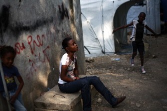 Kettely Gadet, one of many disabled by the earthquake that devastated Haiti nearly one year ago, is seated on a concrete bench January 6, 2011 in Port-au-Prijnce. AFP Kettely Gadet, one of many disabled by the earthquake that devastated Haiti nearly one year ago, is seated on a concrete bench January 6, 2011 in Port-au-Prijnce. AFP