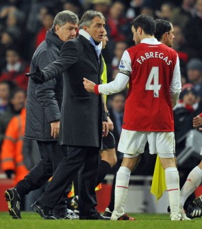 Roberto Mancini (2nd L) speaks with Arsenal's Spanish midfielder Cesc Fabregas (R) after the match between Arsenal and Manchester City on January 5, 2011. AFP Roberto Mancini (2nd L) speaks with Arsenal's Spanish midfielder Cesc Fabregas (R) after the match between Arsenal and Manchester City on January 5, 2011. AFP