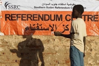 A Sudanese boy stands in front of a referendum centre in Haj Yussef district in Khartoum. A Sudanese boy stands in front of a referendum centre in Haj Yussef district in Khartoum.