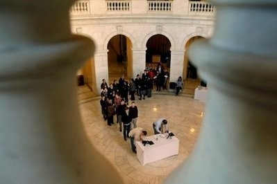 People wait in line to sign condolence books for the victims of Saturday's mass shooting in Arizona in the Cannon House Office Building on Capitol Hill People wait in line to sign condolence books for the victims of Saturday's mass shooting in Arizona in the Cannon House Office Building on Capitol Hill