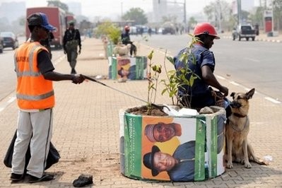A security guard sits beside campaign posters featuring Nigeria's President Goodluck Jonathan and new Vice-President Namadi Sambo at the venue of presidential primaries for the ruling Peoples Democratic Party in Abuja A security guard sits beside campaign posters featuring Nigeria's President Goodluck Jonathan and new Vice-President Namadi Sambo at the venue of presidential primaries for the ruling Peoples Democratic Party in Abuja