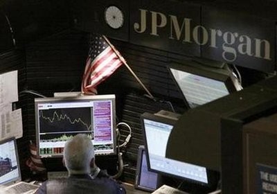 A trader works in the J.P. Morgan stall on floor of the New York Stock Exchange, September 14, 2009. A trader works in the J.P. Morgan stall on floor of the New York Stock Exchange, September 14, 2009.