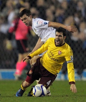 Leeds midfielder Jonny Howson (L) vies with Arsenal's captain Cesc Fabregas during the FA Cup third round replay football match at Elland Road on January 19, 2011. AFP Leeds midfielder Jonny Howson (L) vies with Arsenal's captain Cesc Fabregas during the FA Cup third round replay football match at Elland Road on January 19, 2011. AFP