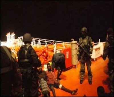 AFP - This picture taken on January 21 and released courtesy of the Royal Malaysian Navy shows Somalian pirates being guarded by Malaysian naval commandos AFP - This picture taken on January 21 and released courtesy of the Royal Malaysian Navy shows Somalian pirates being guarded by Malaysian naval commandos