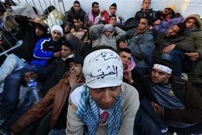 Protesters from Tunisia's marginalised rural heartlands prepare to spend their second night outside the Prime Minister's office in Tunis January 24, 2011. Protesters from Tunisia's marginalised rural heartlands prepare to spend their second night outside the Prime Minister's office in Tunis January 24, 2011.