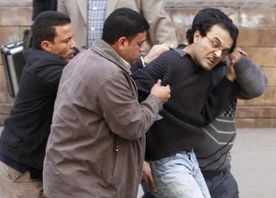 AFP - Egyptian police arrest a demonstrator in Cairo. AFP - Egyptian police arrest a demonstrator in Cairo.