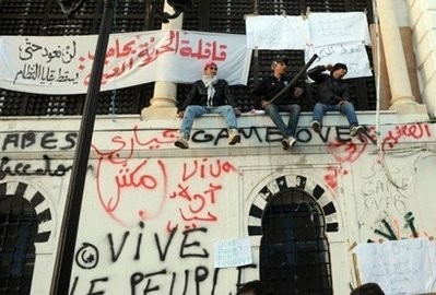 AFP- Residents from the central Tunisian regions of Sidi Bouzid and Kasserine protest in front of Prime Minister Mohammed Ghannouchi's office in Tunis AFP- Residents from the central Tunisian regions of Sidi Bouzid and Kasserine protest in front of Prime Minister Mohammed Ghannouchi's office in Tunis