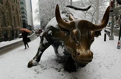 AFP- A woman walks past the bronze bull statue near Wall Street in lower Manhattan on January 26, in New York. AFP- A woman walks past the bronze bull statue near Wall Street in lower Manhattan on January 26, in New York.