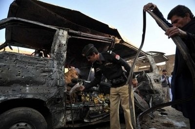 AFP file - A Pakistani policeman inspects a van after a suicide attack in Kohat on December 8, 2010 AFP file - A Pakistani policeman inspects a van after a suicide attack in Kohat on December 8, 2010