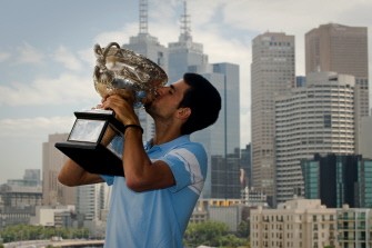 Novak Djokovic kisses the Australian Open tennis tournament championship trophy as he poses for photographers in Melbourne on January 31, 2011. AFP Novak Djokovic kisses the Australian Open tennis tournament championship trophy as he poses for photographers in Melbourne on January 31, 2011. AFP