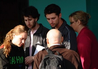 US citizen George Fosmire (2L), 23, a survivor from the tourist boat that sank in Halong Bay, along with two other unidentified survivors (L and 2R) talk with two unidentified Hanoi-based diplomats as they prepare to leave a hotel in the northeastern Vietnamese city of Ha Long on February 17, 2011. US citizen George Fosmire (2L), 23, a survivor from the tourist boat that sank in Halong Bay, along with two other unidentified survivors (L and 2R) talk with two unidentified Hanoi-based diplomats as they prepare to leave a hotel in the northeastern Vietnamese city of Ha Long on February 17, 2011.