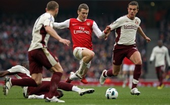 AFP - Jack Wilshere (3rd L) evades a challenge from Sunderland's Sulley Muntari (L) AFP - Jack Wilshere (3rd L) evades a challenge from Sunderland's Sulley Muntari (L)