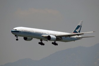 AFP file - In a file picture taken on August 4, 2010 a Cathay Pacific aircraft prepares to land at Hong Kong international airport. AFP file - In a file picture taken on August 4, 2010 a Cathay Pacific aircraft prepares to land at Hong Kong international airport.