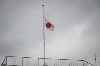 The Japanese flag flies half mast on the top of a building in Kamaishi, in Iwate prefecture on March 25, 2011. The death toll from a massive earthquake and tsunami that devastated Japan's northeast coast topped 10,000. AFP The Japanese flag flies half mast on the top of a building in Kamaishi, in Iwate prefecture on March 25, 2011. The death toll from a massive earthquake and tsunami that devastated Japan's northeast coast topped 10,000. AFP