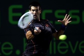 AFP - Djokovic hits a return against Kevin Andersonon March 30, 2011 AFP - Djokovic hits a return against Kevin Andersonon March 30, 2011