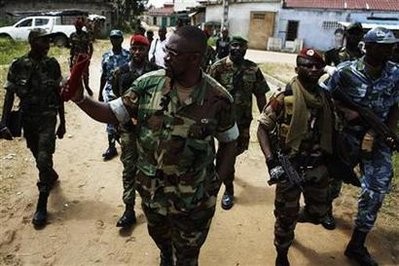 brahim Coulibaly (C), head of the Invisible Commandos, walks with his troops through the Abobo neighbourhood of Ivory Coast's main city Abidjan in this April 19, 2011 file photo brahim Coulibaly (C), head of the Invisible Commandos, walks with his troops through the Abobo neighbourhood of Ivory Coast's main city Abidjan in this April 19, 2011 file photo