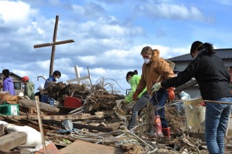 AFP - Volunteers clear up rubble around the Kesennuma Daiichi Bible Baptist Church in the devastated city of Kesennuma, Miyagi prefecture, in northeastern Japan on May 2, 2011. AFP - Volunteers clear up rubble around the Kesennuma Daiichi Bible Baptist Church in the devastated city of Kesennuma, Miyagi prefecture, in northeastern Japan on May 2, 2011.