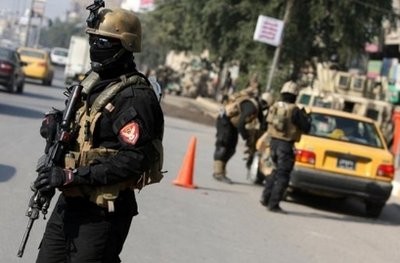 File picture shows members of an Iraqi anti-terror unit guarding a checkpoint in Baghdad. File picture shows members of an Iraqi anti-terror unit guarding a checkpoint in Baghdad.