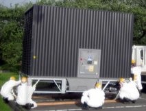 In this May 13, 2011 photo released by Tokyo Electric Power Co., workers wearing a radiation protection In this May 13, 2011 photo released by Tokyo Electric Power Co., workers wearing a radiation protection