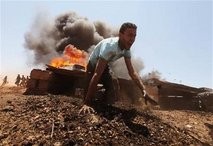 A civilian volunteer of the rebel army clears an obstacle course during training in Benghazi May 15 A civilian volunteer of the rebel army clears an obstacle course during training in Benghazi May 15