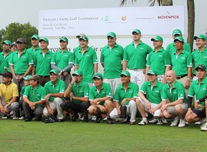 Golfers (not all seen in the picture) pose for a group photo during the charity tournament at Song Be Golf Course on May 14, 2011 Golfers (not all seen in the picture) pose for a group photo during the charity tournament at Song Be Golf Course on May 14, 2011