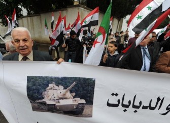 AFP - Activists from the Support Committee to the Syrian People holding Syrian flags stage a demonstration on May 21, 2011 in front of the Syrian embassy in Algiers. AFP - Activists from the Support Committee to the Syrian People holding Syrian flags stage a demonstration on May 21, 2011 in front of the Syrian embassy in Algiers.