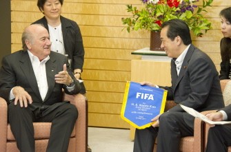AFP - Japan's Prime Minister Naoto Kan (R) holds a complimentary FIFA banner presented by FIFA President, Joseph Blatter (L) prior to their talks at Kan's official residence in Tokyo on 23 May, 2011. Japan is seeking to reassure Blatter that it is a safe venue for hosting world football as the FIFA president visits in the wake of a tsunami AFP - Japan's Prime Minister Naoto Kan (R) holds a complimentary FIFA banner presented by FIFA President, Joseph Blatter (L) prior to their talks at Kan's official residence in Tokyo on 23 May, 2011. Japan is seeking to reassure Blatter that it is a safe venue for hosting world football as the FIFA president visits in the wake of a tsunami