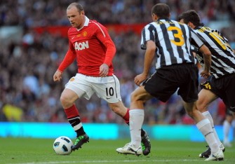 AFP - Manchester United's Rooney (L) runs with the ball during a testimonial football match between Manchester United and Juventus for United's Gary Neville at Old Trafford in Manchester on May 24, 2011. AFP - Manchester United's Rooney (L) runs with the ball during a testimonial football match between Manchester United and Juventus for United's Gary Neville at Old Trafford in Manchester on May 24, 2011.