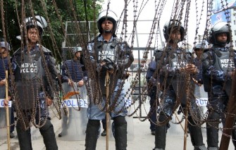 AFP - Nepalese police officials stand guard outside the Constitutional Assembly building in Kathmandu on May 28, 2011. AFP - Nepalese police officials stand guard outside the Constitutional Assembly building in Kathmandu on May 28, 2011.