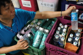 AFP - A worker displays a sports drinks containing a platicizer called DEHP after removing at a supermarket in Hsintien, New Taipei City, on May 26, 2011. AFP - A worker displays a sports drinks containing a platicizer called DEHP after removing at a supermarket in Hsintien, New Taipei City, on May 26, 2011.