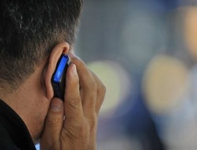 AFP file- A man uses a cell phone in New York. AFP file- A man uses a cell phone in New York.