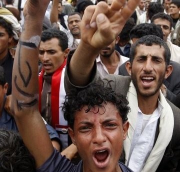 Yemeni anti-government protesters shout slogans during a demonstration calling for the ouster of President Ali Abdullah Saleh in Sanaa amid heavy fighting in the city Yemeni anti-government protesters shout slogans during a demonstration calling for the ouster of President Ali Abdullah Saleh in Sanaa amid heavy fighting in the city
