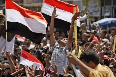 An anti-government protestor, center, reacts as he and other protestors celebrate President Ali Abdullah Saleh's departure to Saudi Arabia, in Sanaa, Yemen, Sunday, June 5, 2011 An anti-government protestor, center, reacts as he and other protestors celebrate President Ali Abdullah Saleh's departure to Saudi Arabia, in Sanaa, Yemen, Sunday, June 5, 2011