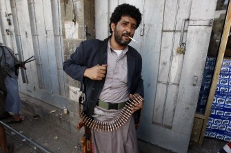 AFP - A tribesman loyal to Yemeni opposition tribal chief Sheikh Sadiq al-Ahmar arranges his ammunitions belt as he and others stand guard near his house in the capital Sanaa on June 6, 2011 AFP - A tribesman loyal to Yemeni opposition tribal chief Sheikh Sadiq al-Ahmar arranges his ammunitions belt as he and others stand guard near his house in the capital Sanaa on June 6, 2011