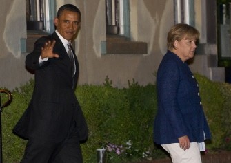 AFP - US President Barack Obama waves alongside German Chancellor Angela Merkel as they leave the 1789 Restaurant following dinner in Washington, DC, June 6, 2011. AFP - US President Barack Obama waves alongside German Chancellor Angela Merkel as they leave the 1789 Restaurant following dinner in Washington, DC, June 6, 2011.