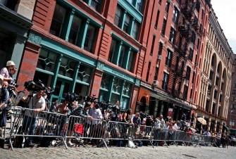 AFP - Media congregates across from the apartment of Dominique Strauss-Kahn where he is staying with his wife, after his court appointment in New York, NY June 6, 2011. AFP - Media congregates across from the apartment of Dominique Strauss-Kahn where he is staying with his wife, after his court appointment in New York, NY June 6, 2011.