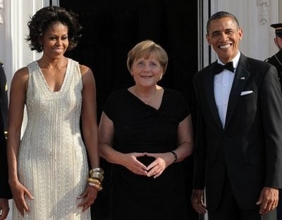 AFP - US President Barack Obama (R) and First Lady Michelle Obama greet German Chancellor Angela Merkel at the North Portico of the White House in Washington, DC. AFP - US President Barack Obama (R) and First Lady Michelle Obama greet German Chancellor Angela Merkel at the North Portico of the White House in Washington, DC.