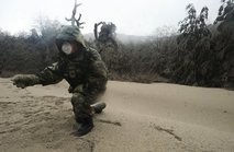 AFP – A soldier inspects volcanic ash near the Puyehue volcano in Chile on June 7, 2011. AFP – A soldier inspects volcanic ash near the Puyehue volcano in Chile on June 7, 2011.