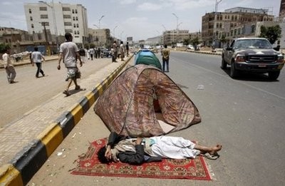 A Yemen anti-government protester sleeps on a rug near tents in Sanaa set up by protesters demanding an interim presidential council to prevent embattled President Ali Abdullah Saleh from returning to power. A Yemen anti-government protester sleeps on a rug near tents in Sanaa set up by protesters demanding an interim presidential council to prevent embattled President Ali Abdullah Saleh from returning to power.